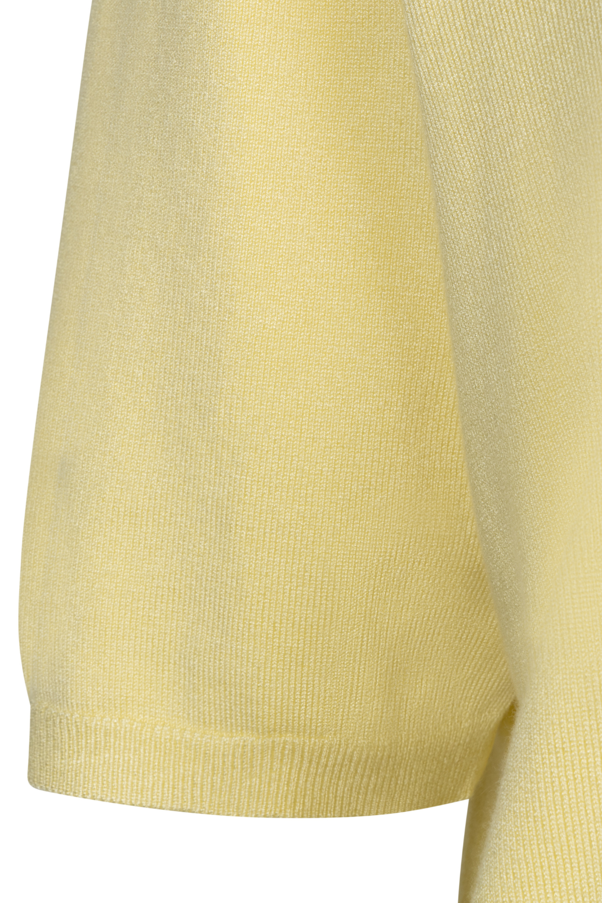 Close-up of a light yellow sweater on a white background
