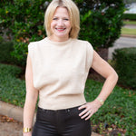 Sleeveless knit muscle sweater vest styled with trousers