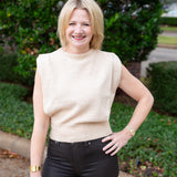 Sleeveless knit muscle sweater vest styled with trousers