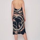 Model wearing a printed midi skirt with a coordinating floral-inspired pattern and flowing silhouette.