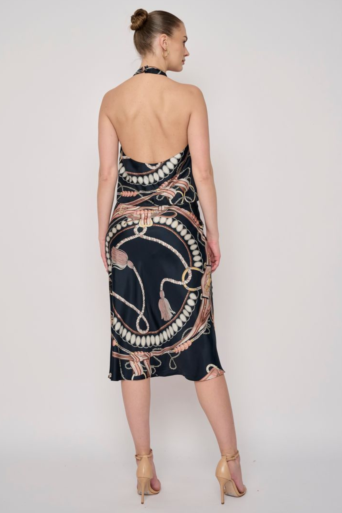 Model wearing a printed midi skirt with a coordinating floral-inspired pattern and flowing silhouette.