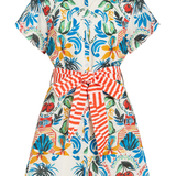 Colorful dress with a tropical pattern and red striped belt on a white background