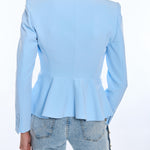 Light blue blazer with peplum waist worn by a person on a white background