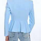 Light blue blazer with peplum waist worn by a person on a white background
