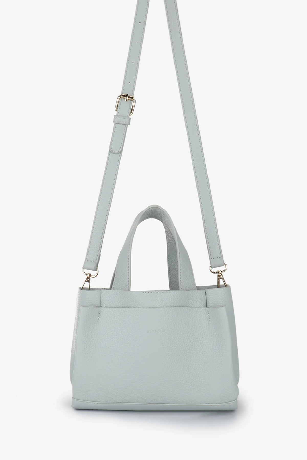 Light blue handbag with a matching strap on a white background