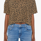 Model wearing a brown striped short-sleeve boxy ringer T-shirt with contrast trim and blue denim.