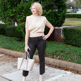 Sleeveless knit muscle sweater vest styled with trousers