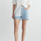 woman in white button down and drawstring stripe denim shorts on white background 