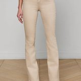 Person wearing beige pants and a white shirt against a plain background