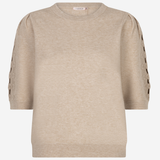 A beige crewneck knit sweater with three-quarter sleeves featuring decorative cutout lace-up detailing on the upper sleeves, shown against a plain white background.