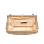 Gold clutch bag with 'Urban' brand name on a white background