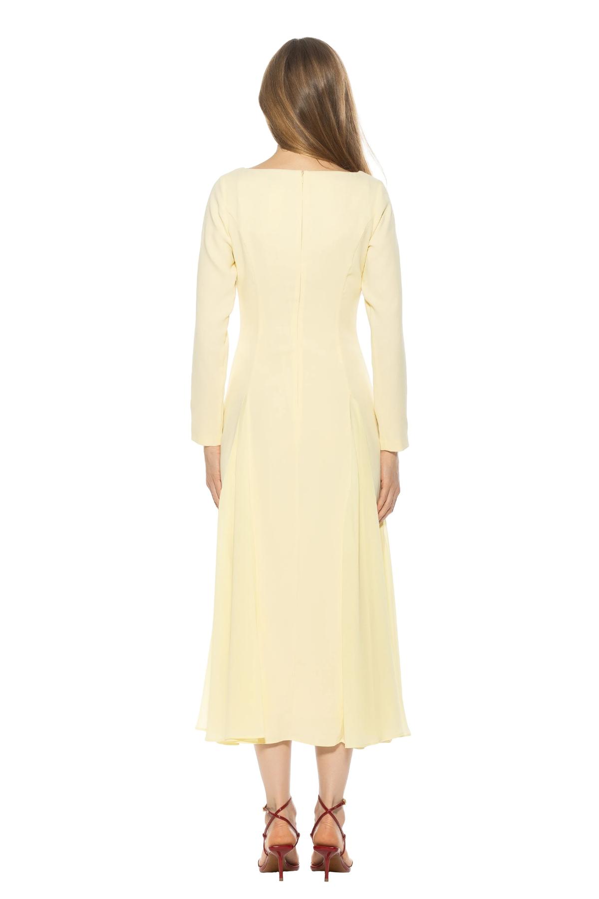 back of woman in butter yellow midi dress and long sleeves on white background 