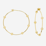 Gold hoop earrings with small bead details, shown on a plain light gray background.