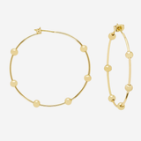 Gold hoop earrings with small bead details, shown on a plain light gray background.