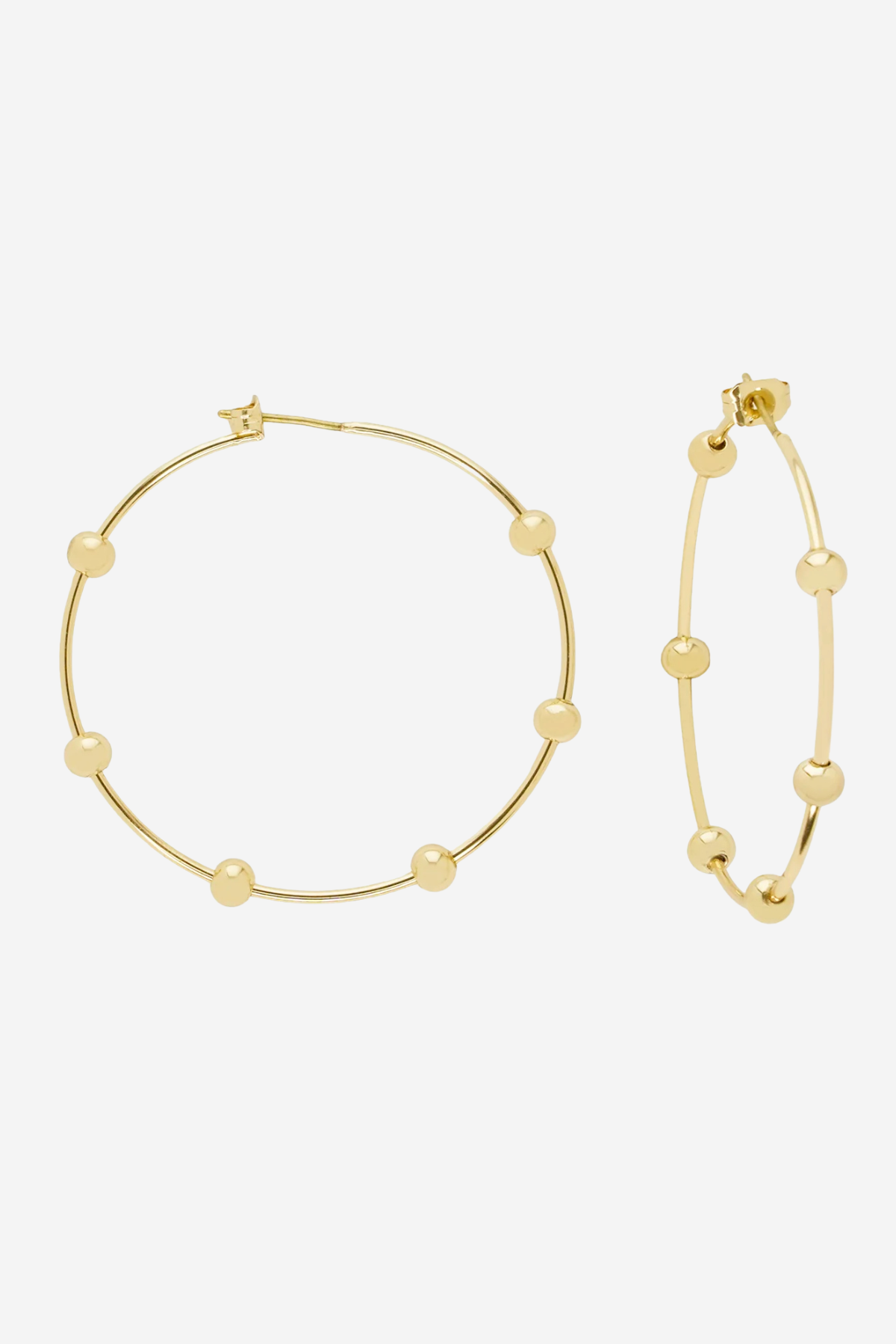 Gold hoop earrings with small bead details, shown on a plain light gray background.