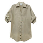 Beige shirt with rolled-up sleeves on a white background