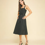 Black faux leather midi dress with button detailing.