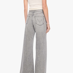 A woman shown from the back wearing light gray wide-leg denim jeans, a white ribbed tank top, and black heels against a plain white studio background.