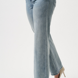 Light blue jeans worn by a person on a white background