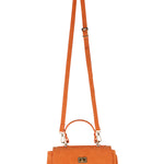 Orange handbag with a strap on a white background