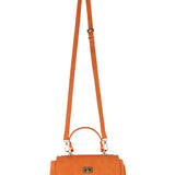 Orange handbag with a strap on a white background