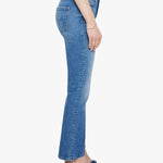 Woman wearing mid-wash cropped flare jeans with a slim upper fit and subtle kick-flare hem.