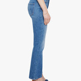 Woman wearing mid-wash cropped flare jeans with a slim upper fit and subtle kick-flare hem.