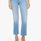 Light blue jeans worn by a person on a white background