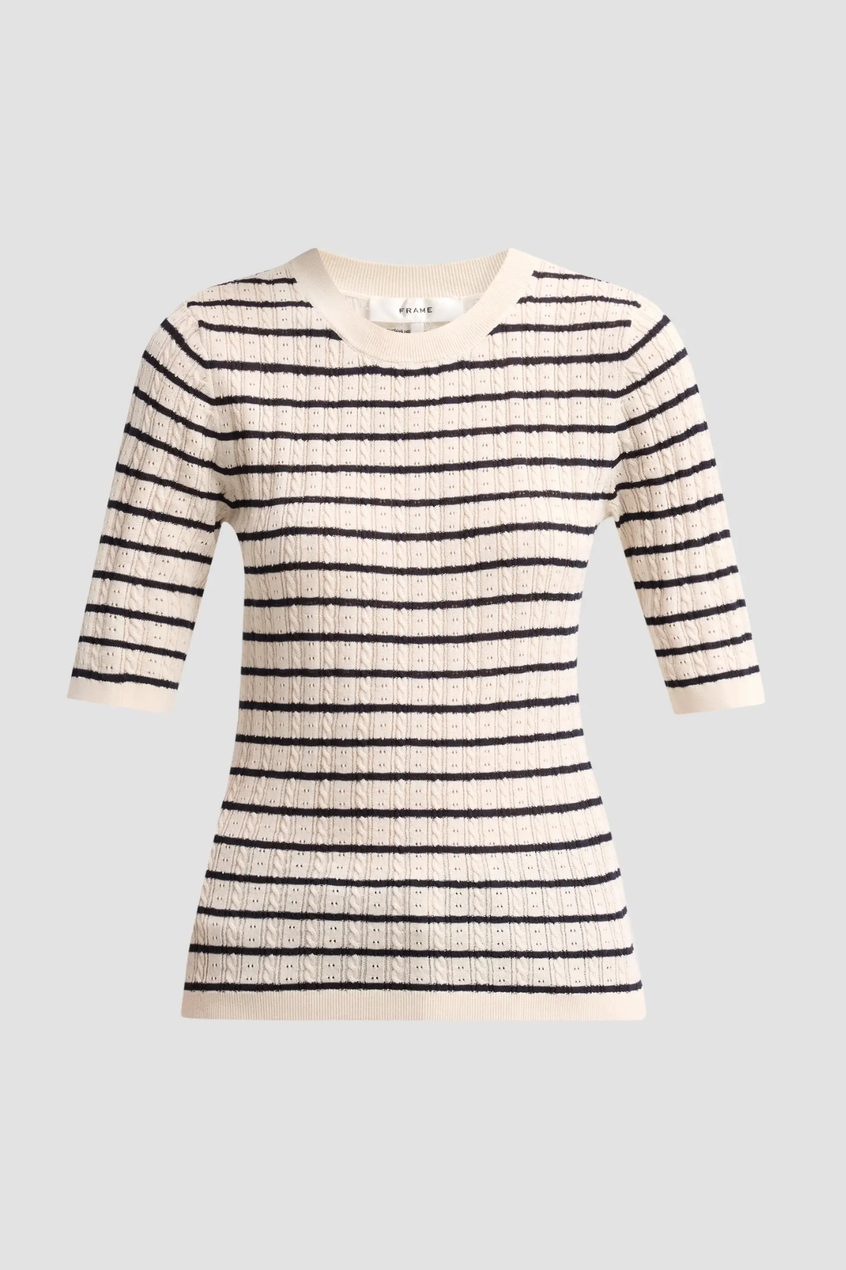 A textured knit sweater with horizontal black stripes on a cream base, featuring three-quarter sleeves and a crew neck, shown against a solid light gray background.