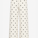 Off-white wide-leg jeans with a black polka dot pattern, shown against a plain white background.