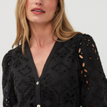 close up on woman in black dress on white background 