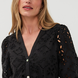 close up on woman in black dress on white background 