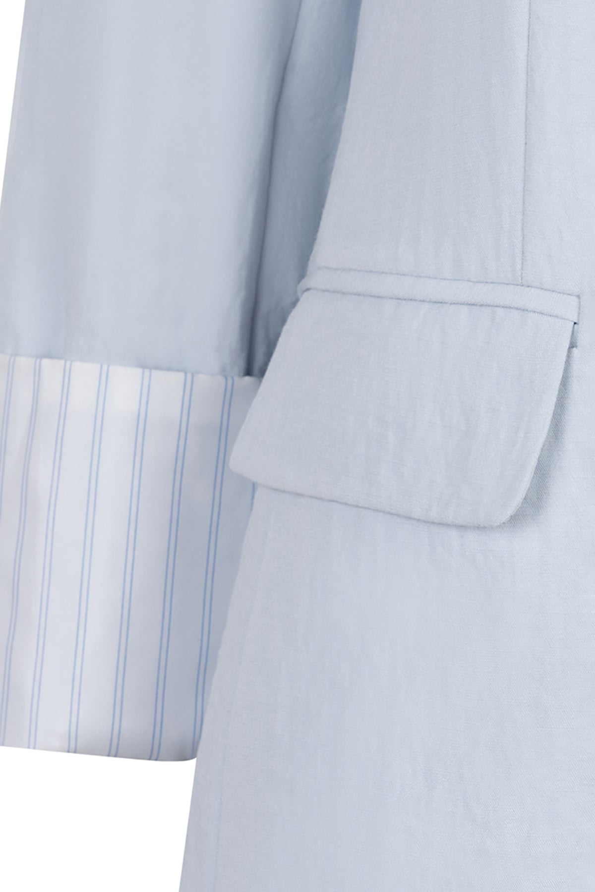 Light blue suit jacket with striped shirt collar on a white background