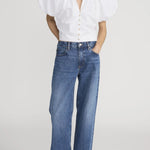 Blouse with dramatic voluminous sleeves styled with denim