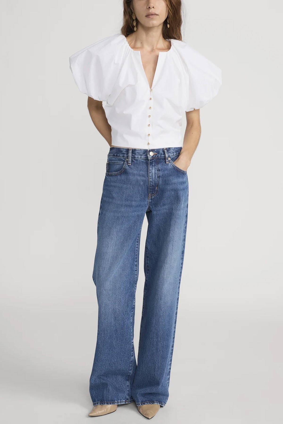 Blouse with dramatic voluminous sleeves styled with denim