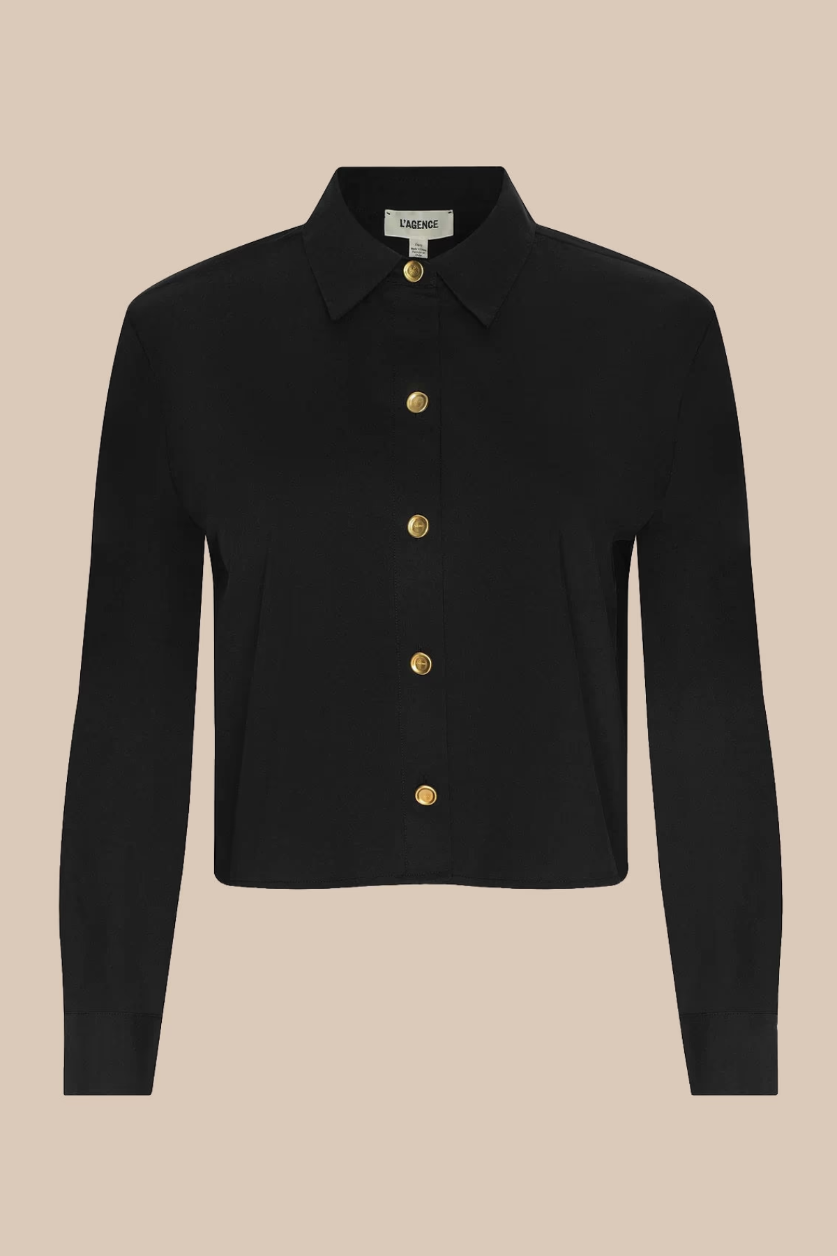 A black long-sleeve collared shirt jacket with gold buttons, displayed on a solid beige background.