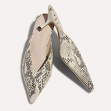 snakeskin kitten heels on white background 