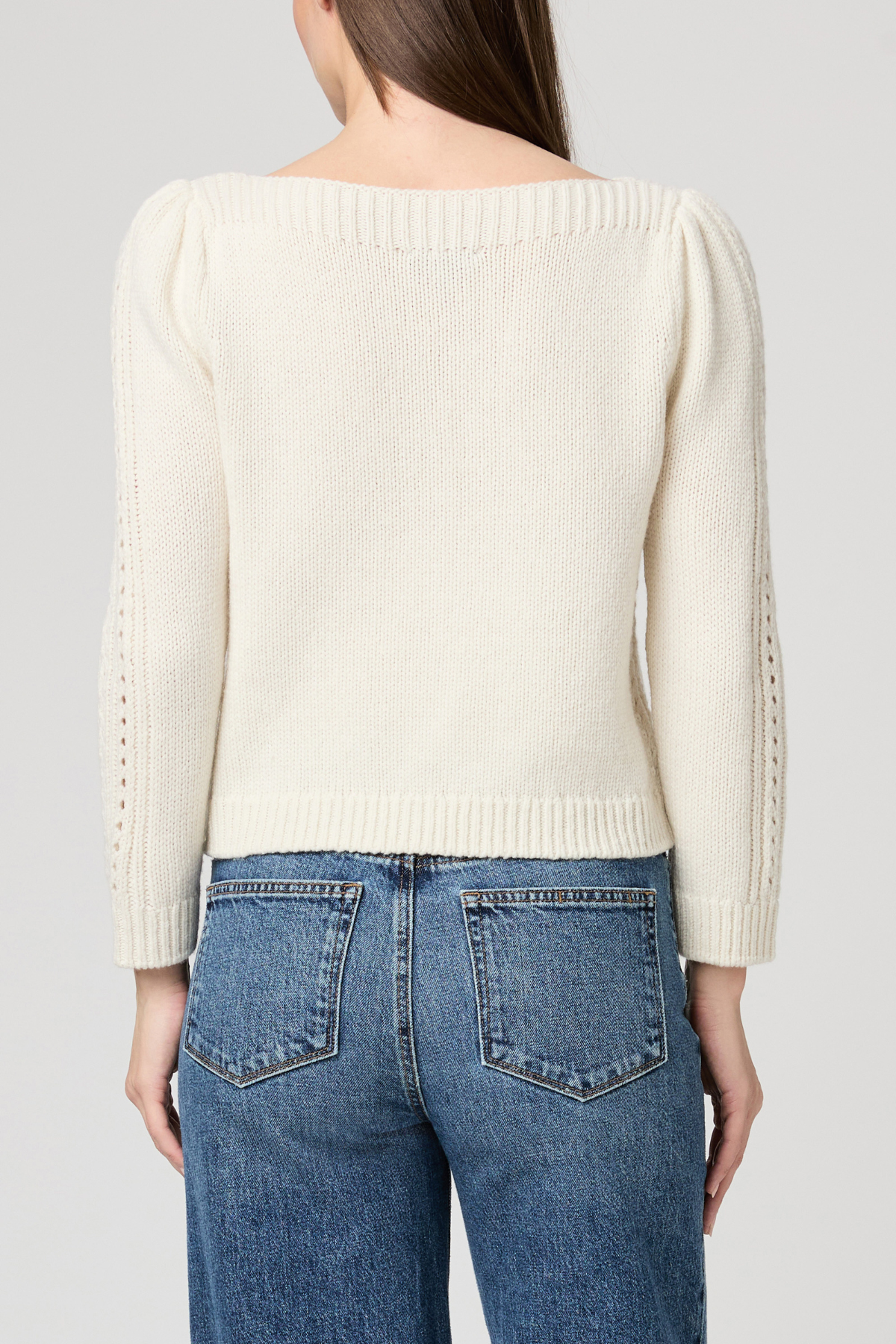 Women's ivory sweater featuring long sleeves, a classic neckline, and relaxed silhouette.