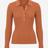 A ribbed knit long-sleeve polo shirt in a warm rust orange color, featuring a collar and three decorative buttons on the placket, shown against a plain light gray background.