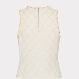 An off-white sleeveless knit top with a subtle gold diamond lattice pattern and a small silver zipper at the neckline, shown against a light gray background.