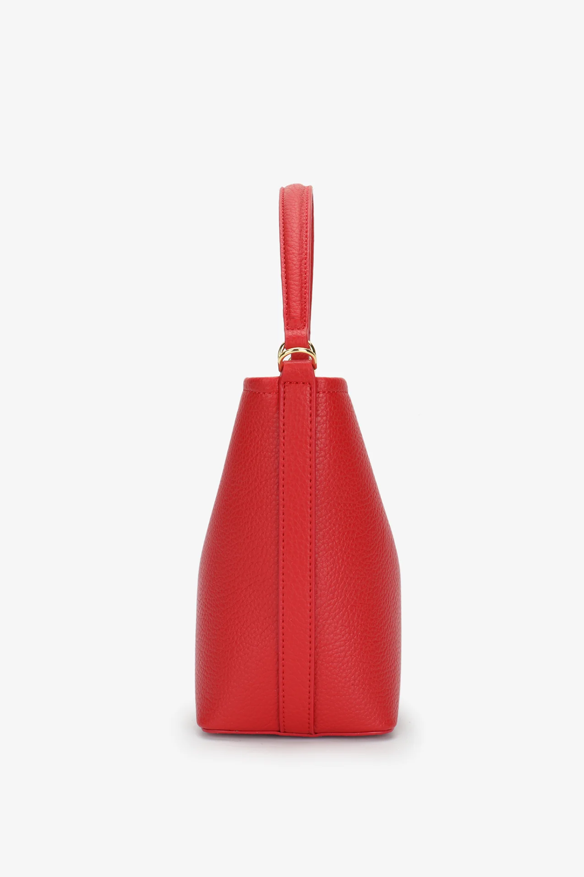 side view of red handbag on white background