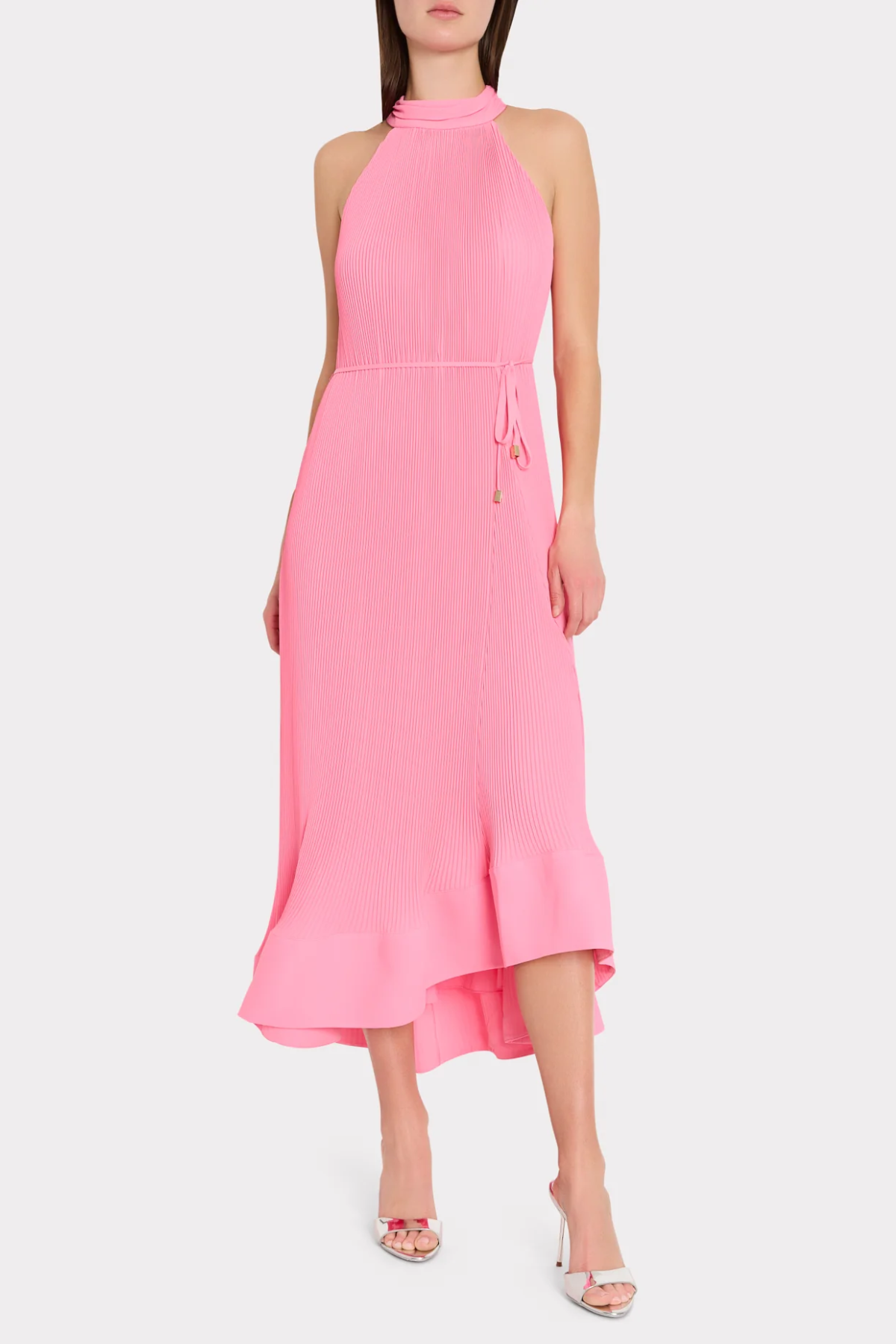 Pink halter neck dress on a white background
