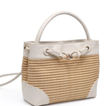 Woven handbag with white accents on a white background