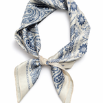 Blue and white patterned scarf tied into a knot on a white background