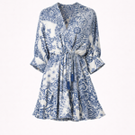 Blue and white patterned dress on a white background