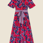 Colorful floral dress with a belt on a beige background