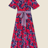 Colorful floral dress with a belt on a beige background