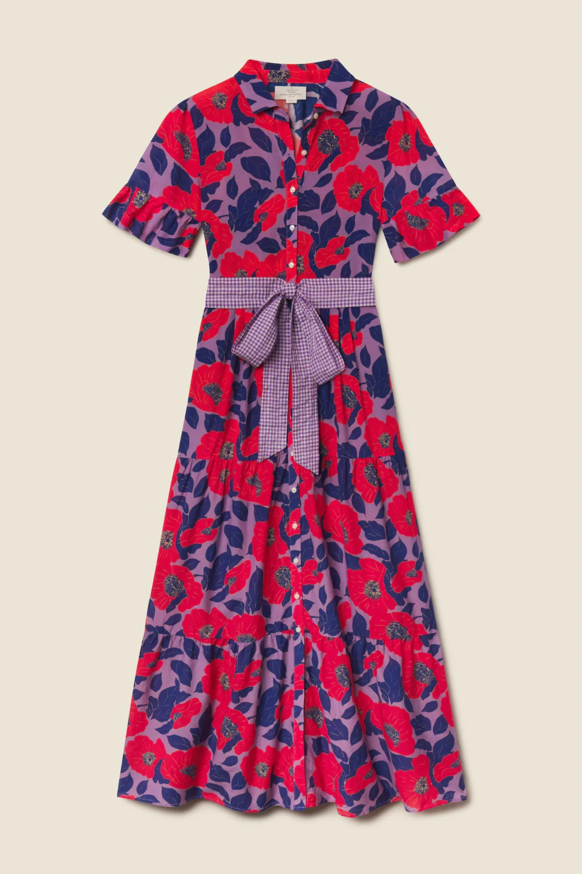 Colorful floral dress with a belt on a beige background