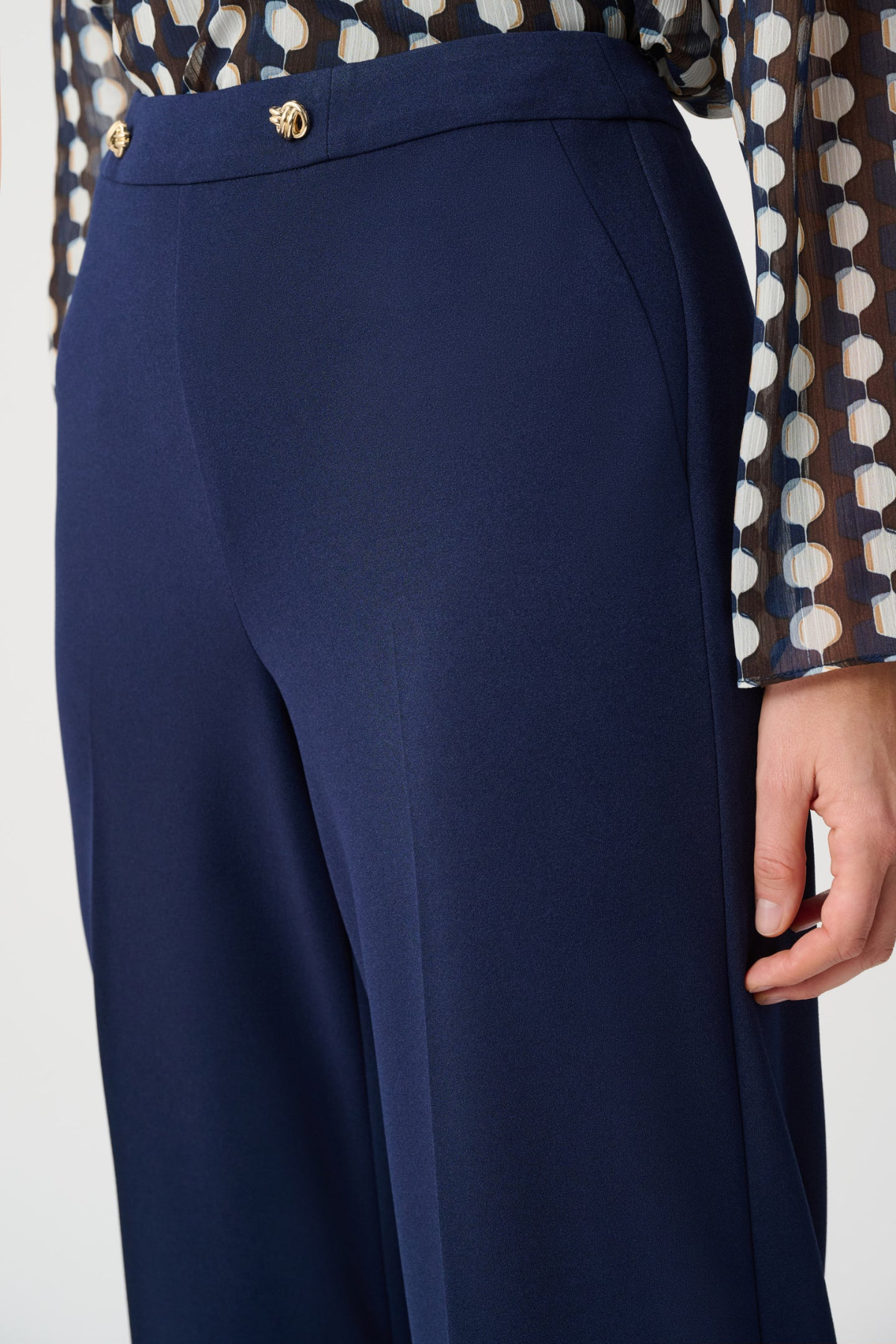 Model wearing navy scuba crepe pull-on wide-leg pants.