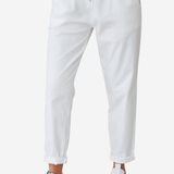 Women's lightweight white jogger pants featuring a drawstring waistband, side pockets, and tapered leg.